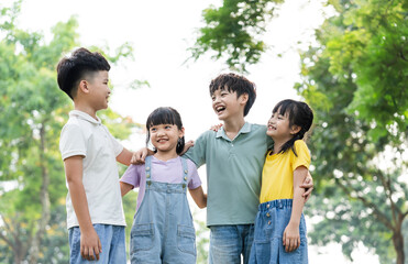 group of cute asian kids having fun in the park