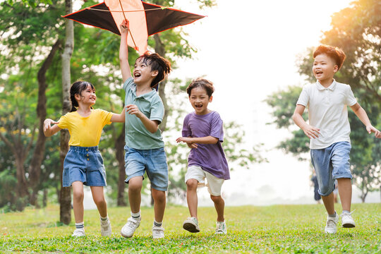 group image of cute asian children playing in the park