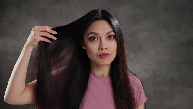 Asian Beauty doing a photo shooting in a studio - extreme slow motion