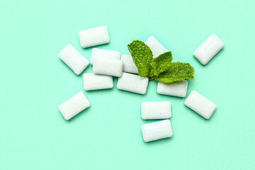 Fresh chewing gums with mint on turquoise background