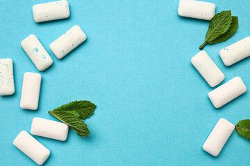 Fresh chewing gums with mint on blue background