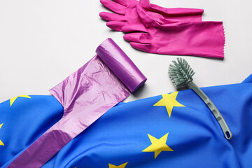 Composition with cleaning supplies and flag of European Union on grey background © Pixel-Shot