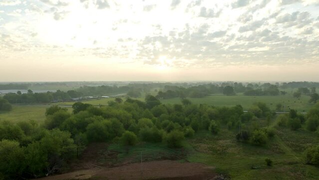 Warm Sunrise Over Nature Landscape In Gentry, Benton County, Arkansas. aerial pullback, hyperlapse