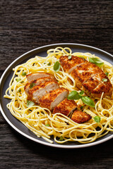 crusted chicken over lemon butter pasta, top view