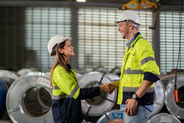 Factory apprenticeship. Man mentor teaching Female employees trainee operating machine looking...