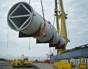 Huge refinery vessel is lloaded onto a transporter multi wheeled vehicle at Barry Beach Marine...