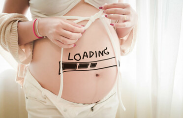 pregnant woman who is about to give birth There was a download sign appearing on the stomach.