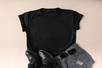 Blank black womens cotton Tshirt mockup with jeans and leather shoes isolated on white background....