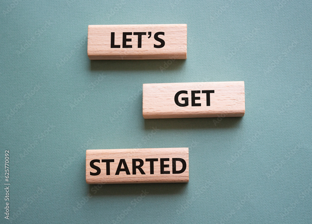 Canvas Prints lets get started symbol. concept words lets get started on wooden blocks. beautiful grey green backg