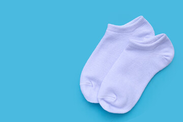 White socks on blue background.