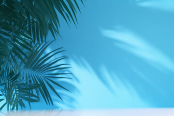 Blurred shadow from palm leaves on the blue wall, Minimal abstract background for product presentation, Spring and summer