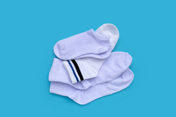White socks on blue background.