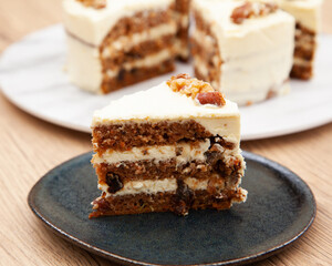 Classic carrot cake with cream cheese frosting, pecan, walnut and raisin