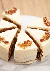 Classic carrot cake with cream cheese frosting, pecan, walnut and raisin