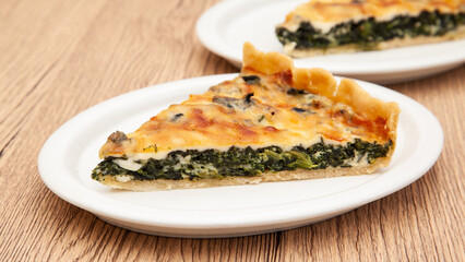 a piece of classic spinach quiche