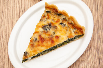 a piece of classic spinach quiche