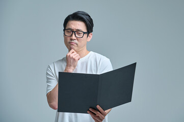 Middle-aged office worker with casual-clad glasses and filing, various emotional expressions