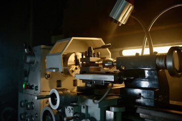 Professional lathe turning machine at motorcycle garage workshop