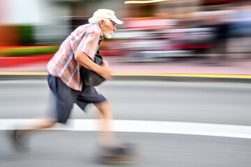 Funny old man running fast on a busy street. Panning image. Generative AI