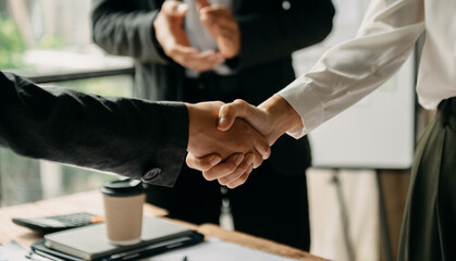 business people shaking hands during a meeting