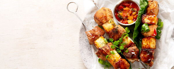 Kebab skewers on a plate.