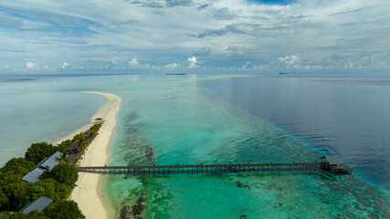 Top view of tropical island and sandy beach. Timba Timba islet. Tun Sakaran Marine Park. Borneo, Sabah, Malaysia.