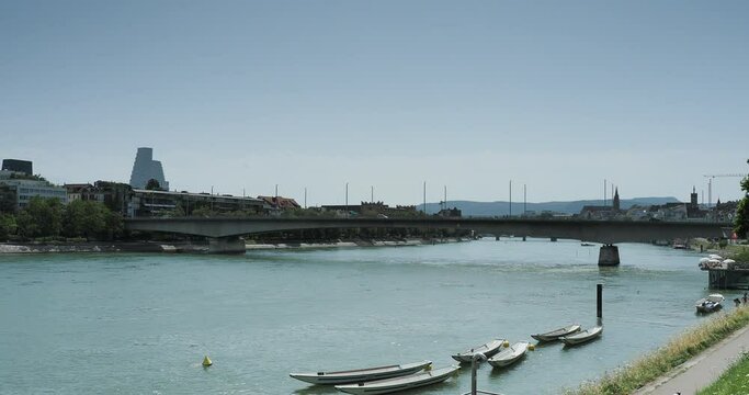 Swiss. Basel. along St. Johann Rhine way. Johanniter Bridge (Johanniterbr&uuml;cke). Right - St Johann Rhinebath, Old city and Cathedrale. Left - Unterer Rheinweg and Roche Tower on horizon
