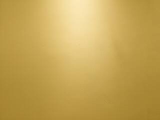 Fototapeta premium Gold Wall with Light from the Top Background.