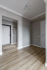 White entrance door inside an apartment in a modern interior