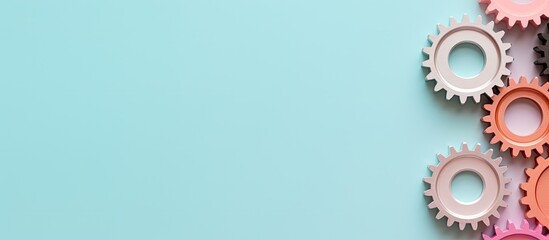 Photo of colorful gears on a vibrant blue background with copy space
