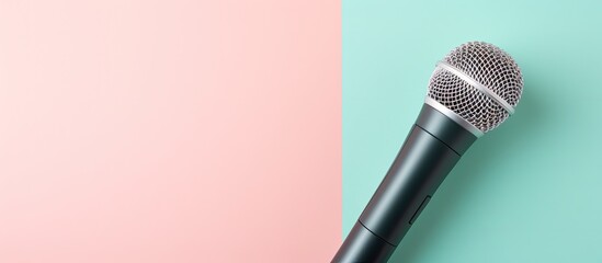 Photo of a microphone on a pastel background with plenty of copy space with copy space