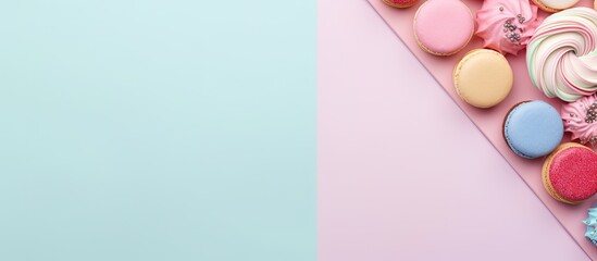 Photo of colorful macarons on a pastel background with plenty of room for text or design with copy space