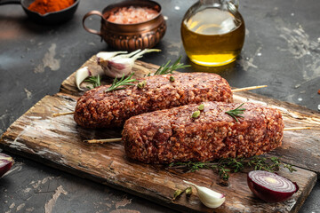Homamade raw meat lula kebabs sausages. Turkish and Arabic Traditional Ramadan kebab, place for...