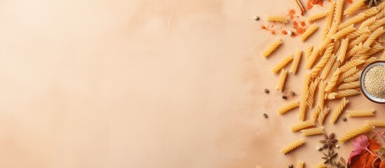 Photo of various types of pasta on a table, ready to be cooked and enjoyed with copy space