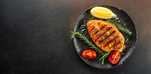 Grilled chicken breast with tomatoes and herbs, Healthy, clean eating. Long banner format. top view