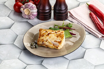 Roasted cod fish steak with salad