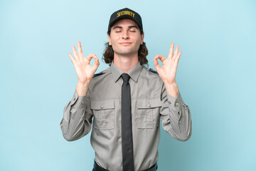 Young safeguard man isolated on blue background in zen pose