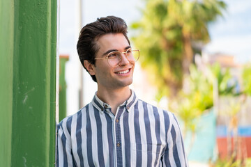 Young handsome man With glasses with happy expression