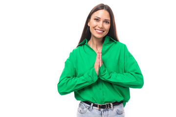 Fototapeta premium friendly cute young brown-haired female model with brown eyes in a green shirt