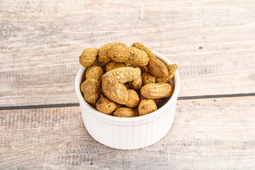 Raw ripe unpeeled peanut heap