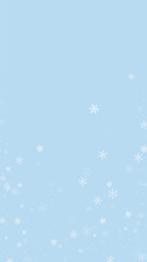 Beautiful snowfall christmas background. Subtle flying snow flakes and stars on light blue winter backdrop. Beautiful snowfall overlay template. Vertical vector illustration.