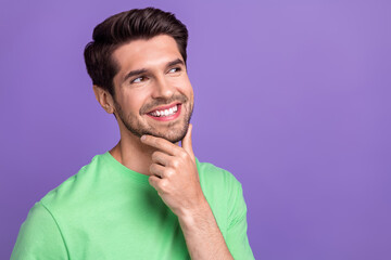 Portrait photo of young thoughtful guy touch chin looking empty space minded virile unshaved...