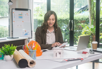 Architectural designer making digital building plan for professional construction renovation in office.