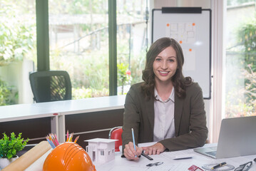 Architectural designer making digital building plan for professional construction renovation in office.