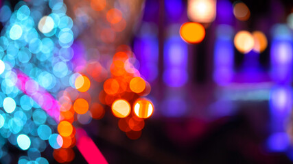 background blurred abstraction of colored lanterns and decorations. bokeh texture of street colored...