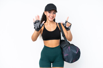 Young sport woman with sport bag isolated on white background counting seven with fingers