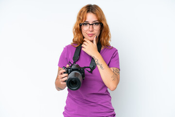 Fototapeta premium Young photographer caucasian woman isolated on white background thinking