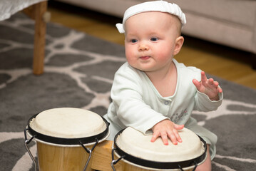 little girl playing the drum