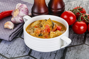 Traditional yellow Thai curry with chicken
