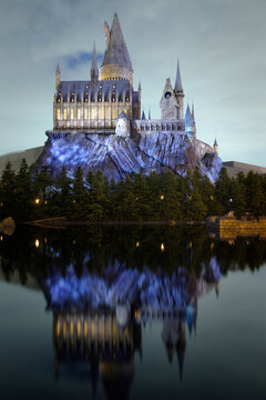 OSAKA, JAPAN - 02022023: Universal Studios Japan . The Hogwarts castle reflect to the water in The Wizarding World of Harry Potter in Universal Studio Osaka